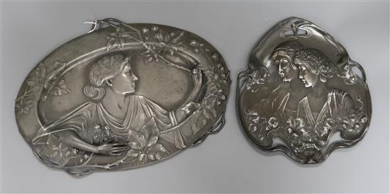 A WMF Art Nouveau dual plaque of a lady and similar smaller plaque